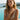 Woman wearing Jade Square Block earrings and Riviera Bold chain bracelet in gold-plated stainless steel by a pool