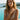 Riviera Bold chain bracelet in gold-plated stainless steel worn at a pool, lifestyle view